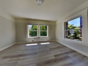 San Francisco apartment for rent - a living room with wooden floors and a large window