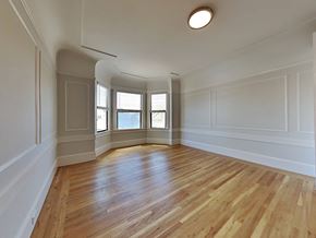 San Francisco apartment for rent - an empty living room with white walls and wood floors