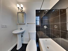 San Francisco apartment for rent - a bathroom with a tub sink and toilet and a shower