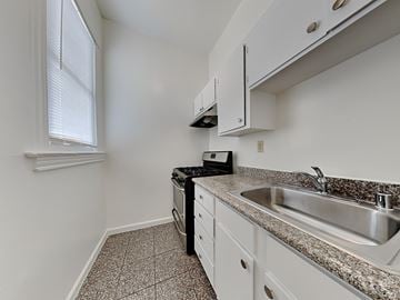 San Francisco apartment for rent - a kitchen with granite counter tops and a sink