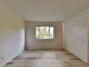 Oakland apartment for rent - an empty room with white walls and a window
