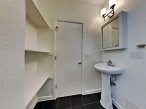 San Francisco apartment for rent - a bathroom with a sink and a shower and a mirror
