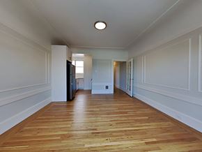 San Francisco apartment for rent - a living room with white walls and a wooden floor