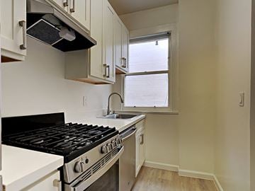 San Francisco apartment for rent - a kitchen with a stove and a sink and a window