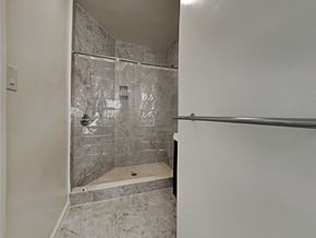 San Francisco apartment for rent - a walk in shower in a bathroom with a glass door
