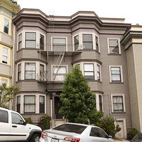 San Francisco apartment for rent - a building with a tree and cars parked in front of it
