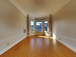 San Francisco apartment for rent - a empty living room with hardwood floors and a window