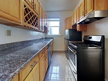 San Francisco apartment for rent - a kitchen with granite counter tops and black appliances