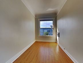 San Francisco apartment for rent - a empty room with a window and wooden floors