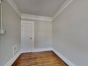 San Francisco apartment for rent - a bedroom with wood flooring and a white door