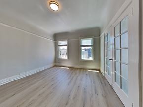 San Francisco apartment for rent - a living room with white walls and wood floors