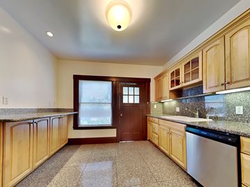 San Francisco apartment for rent - a kitchen with granite counter tops and wooden cabinets