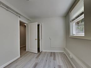 San Francisco apartment for rent - a bedroom with white walls and wood floors and a door to a closet