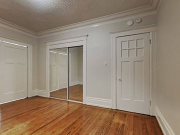 San Francisco apartment for rent - the living room of a house with white doors and wood floors