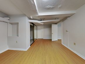 Oakland apartment for rent - a living room with wood floors and white walls and a mirrored door