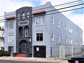 Oakland apartment for rent - a blue building on the side of a street