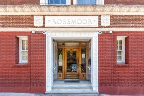 San Francisco apartment for rent - the front of a red brick building with a wooden door
