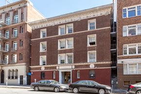 San Francisco apartment for rent - a brick building with cars parked in front of it