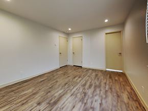 San Francisco apartment for rent - an empty living room with wood flooring and white walls