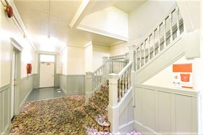 San Francisco apartment for rent - the lobby of a building with stairs and a door