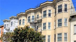 San Francisco apartment for rent - a tall building with a fire escape on the side of it