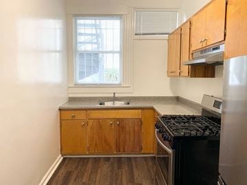 San Francisco apartment for rent - a small kitchen with a stove and a window