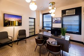 Los Angeles apartment for rent - a conference room with a desk and chairs and a tv