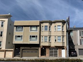 San Francisco apartment for rent - a three story apartment building with a car garage