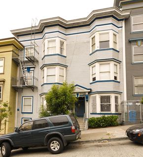 San Francisco apartment for rent - a blue truck parked in front of an apartment building