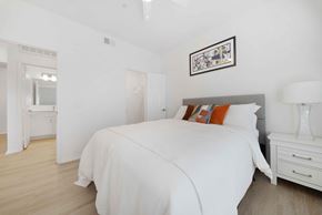 San Diego apartment for rent - A bedroom with a large bed and a white dresser.
