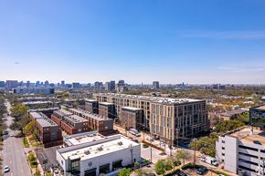 Dallas apartment for rent - A cityscape with buildings and a clear blue sky.