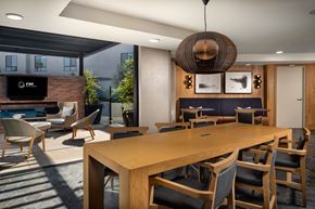 Los Angeles apartment for rent - a dining room with a wooden table and chairs and a fireplace