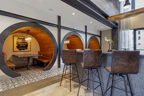 Austin apartment for rent - A modern dining area with a wooden table and chairs.