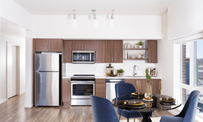 Portland apartment for rent - A modern kitchen with a dining table set for two.