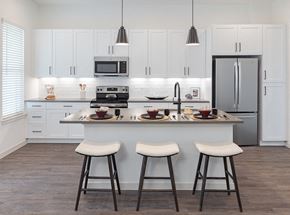 Mckinney townhouse for rent - spacious kitchen with large island and white cabinets