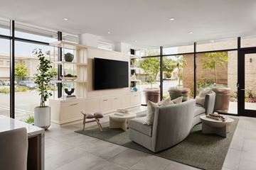 Thousand Oaks apartment for rent - A modern living room with a large grey sofa and a flat screen TV.