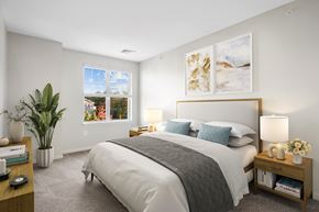 Concord apartment for rent - a bedroom with a large bed and a window