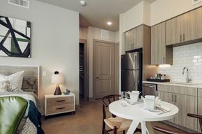 Austin apartment for rent - A modern kitchen with a dining table set for two.