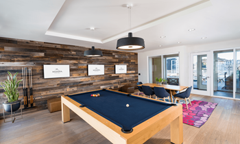 Game room with billiards, arcade games, darts, and plenty of social seating