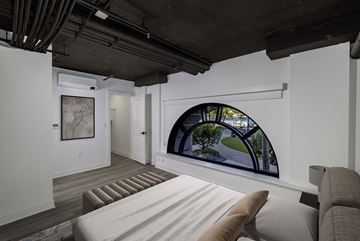 Long Beach apartment for rent - A living room with a couch and a large window.