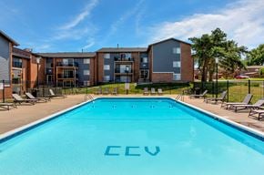 West Des Moines townhouse for rent - country club village apartments pool with apartment buildings in the background