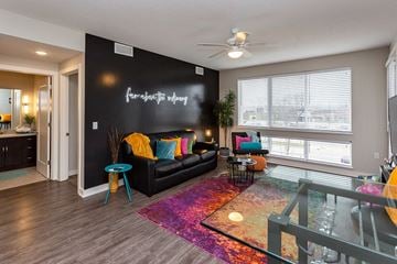 Johnston apartment for rent - a living room with a black accent wall and a couch