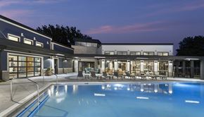 Johnston apartment for rent - pool in the evening with exterior seating