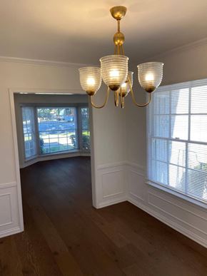 Los Angeles apartment for rent - a view of a dining room with a chandelier and large windows