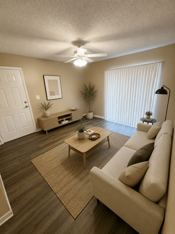 Tampa apartment for rent - A living room with a couch, coffee table, and a ceiling fan.