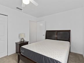 Wimauma apartment for rent - a bedroom with a bed and a closet at The Groves at Wimauma Apartments , Florida 33598