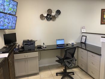Desk with a computer and a printer