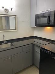 Orlando apartment for rent - a kitchen with a sink and a microwave at Colonial Drive Apartments, Orlando, FL 32808