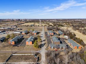 Norman apartment for rent - a aerial view of a neighborhood of houses and a road at Emerald Greens, Norman, OK 73072