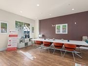 Jacksonville apartment for rent - a conference room with a long table and chairs at Lake Lofts at Deerwood, Jacksonville, FL, 32216